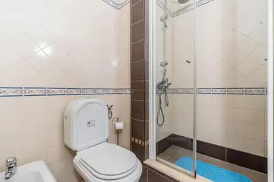 a bathroom with a toilet and a shower at Appartement Algarve,Quarteira Vilamoura Lago Azul in Vilamoura