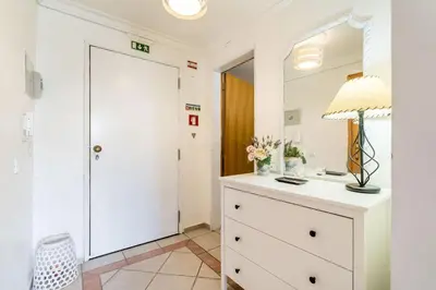 a bathroom with a white dresser and a mirror at Appartement Algarve,Quarteira Vilamoura Lago Azul in Vilamoura