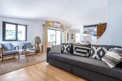 a living room with a couch and a table at Villa Bonita in Albufeira