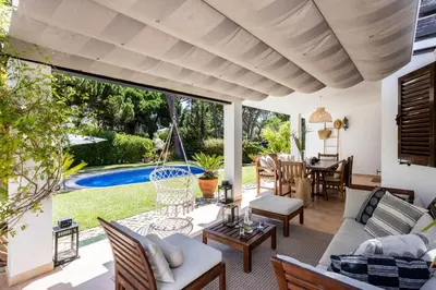 a living room with a couch and a table at Villa Bonita in Albufeira