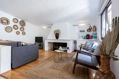 a living room with a couch and a fireplace at Villa Bonita in Albufeira