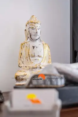 a statue sitting on top of a table at #089 Largo Escola by Home Holidays in Albufeira