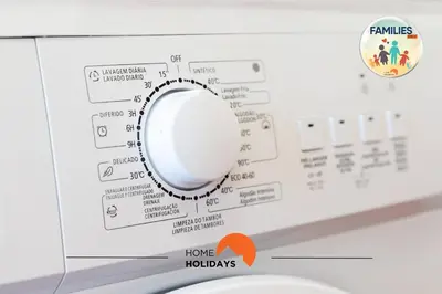 a kitchen with a stove and a washer and dryer at #190 Families Only - Descobrimentos by Home Holidays in Albufeira