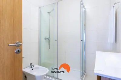 three bottles of moisturizers sitting on a counter in a bathroom at #191 Smile Apartment by Home Holidays in Albufeira