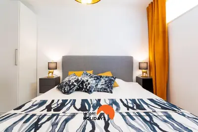 a bedroom with a bed with a large mirror at #221 Cerro Grande by Home Holidays in Albufeira