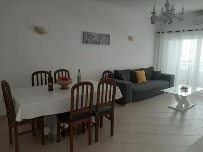 a flat screen tv sitting on top of a white wall at Beach Falésia in Albufeira