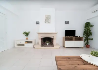 a living room with a fireplace and a tv at 404 - Oura - 2 Bedroom - Sea View in Albufeira