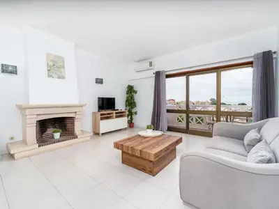 a living room with a couch and a fireplace at 404 - Oura - 2 Bedroom - Sea View in Albufeira