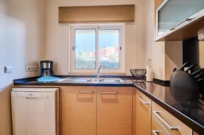 a kitchen with a sink and a window at Apartment Sol de Verão mit Pool in Guia