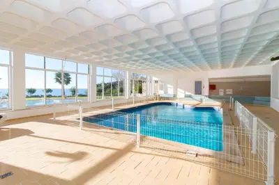 a large swimming pool with a large ceiling at Brisa Mar-Aveiros Apatment by Dalma Portuguesa in Albufeira
