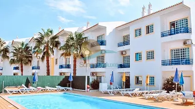 a villa with a swimming pool and a resort at Sereia da Oura by Sunny Deluxe in Vale de Pedras