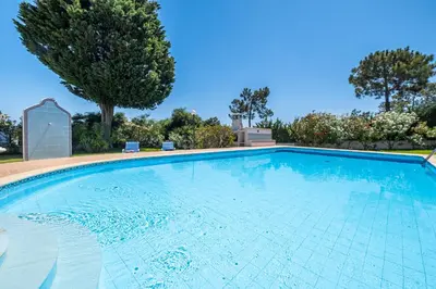 a large swimming pool with blue water at Villa Bella Vista by Algarve Vacation in Albufeira