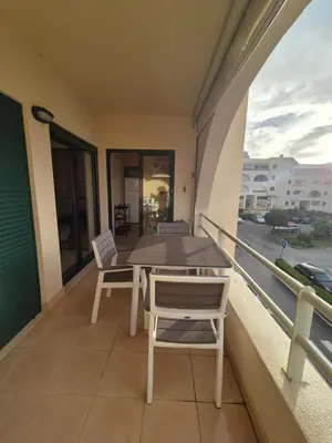 a balcony with a table and chairs on it at Casa Algarve in Albufeira
