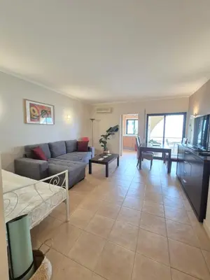 a living room with a couch and a table at Casa Algarve in Albufeira