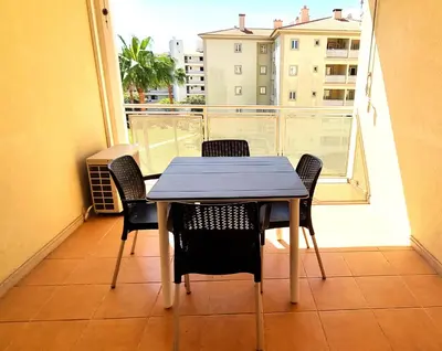 a table and chairs on a balcony with a view at T2 Vilamoura - com piscina e campo tenis in Vilamoura