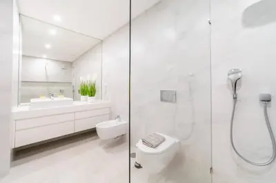 a bathroom with a shower and a toilet and a sink at Villa Marina - 33 by HelloVacations in Albufeira