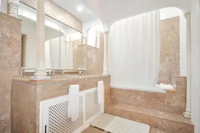 a bathroom with a sink and a mirror at Villa Atlantico in Quarteira