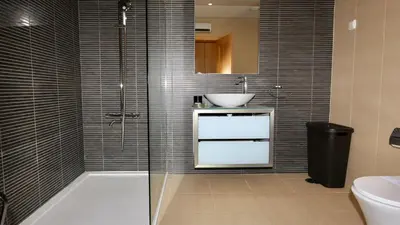 a bathroom with a bath tub and a sink at Aquamar 15 - Clever Details in Vilamoura