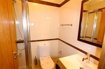 a bathroom with a toilet and a sink and a shower at Antelius 82 - Clever Details in Vilamoura