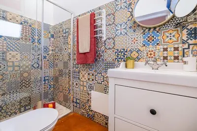 a bathroom with a toilet sink and a mirror at Casa do Cacto in Olhos de Água