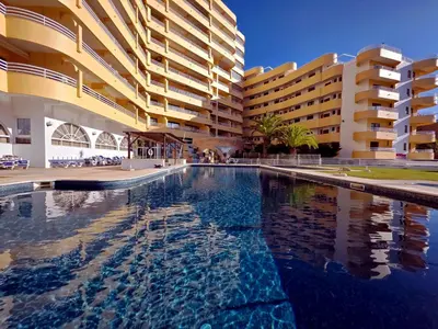 a large swimming pool in front of a building at Marina Mar Retreat by SAPvillas in Vilamoura