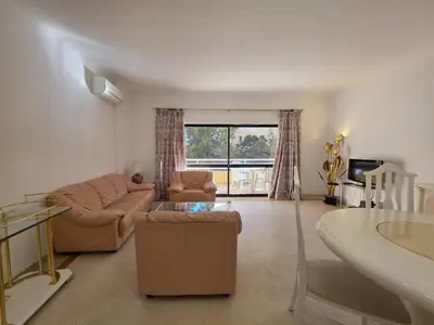 a living room with a couch and a table at Marina Mar Retreat by SAPvillas in Vilamoura