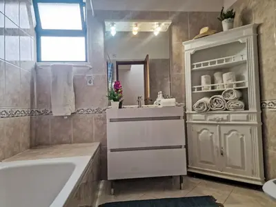 a bathroom with a sink and a mirror at Holiday Home V2 Caliços - VIP Properties by Interhome in Albufeira