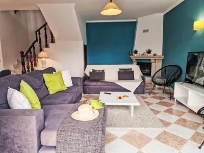 a kitchen with white cabinets and a sink at Holiday Home V2 Caliços - VIP Properties by Interhome in Albufeira