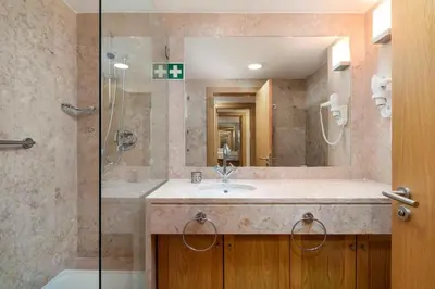 a bathroom with a sink and a shower at 2 bedroom Vila Sol Golf Resort in Quarteira