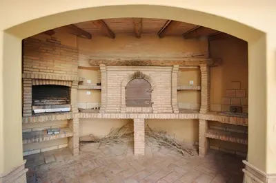 a room with a brick oven in a wall at Villa Rústica in Albufeira