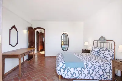 a bathroom with a sink and a tub and a toilet at Villa Rústica in Albufeira