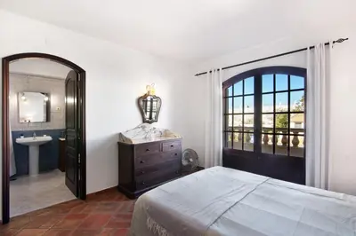 a bathroom with a tub and a sink and a toilet at Villa Rústica in Albufeira