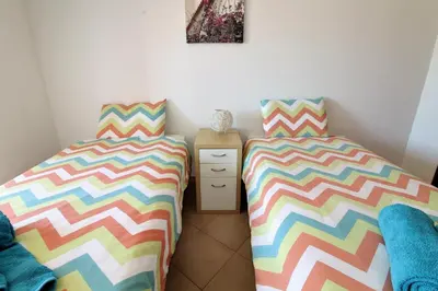 two beds sitting next to each other in a room at Old Town Apartments 2D in Albufeira