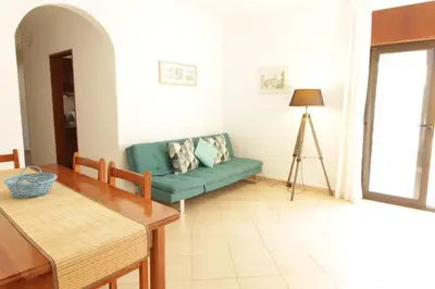 a living room with a couch and a table at Old Town Apartments 2D in Albufeira