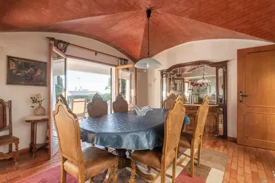 a dining room with a blue table and chairs at Villa Andrea in Albufeira