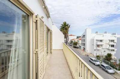 a balcony with a view of a street and buildings at TAC - Cerro Belo in Albufeira
