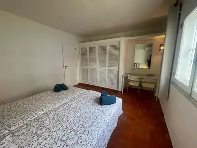 a bedroom with a bed with blue shoes on it at Luxury Villa private pool, Albufeira in Albufeira