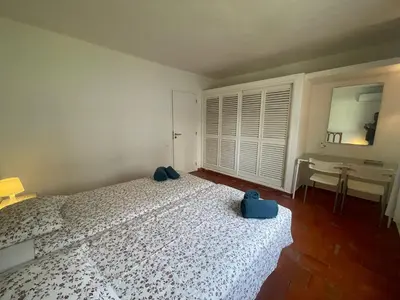 a bedroom with a bed and a sink and a desk at Luxury Villa private pool, Albufeira in Albufeira