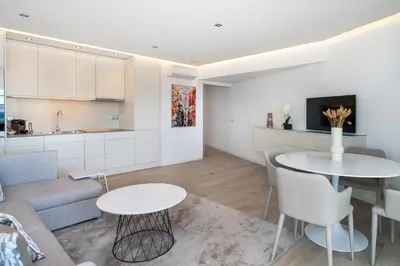 a living room with a couch and a table at Marina Mar Bela Vista by SAPvillas in Vilamoura