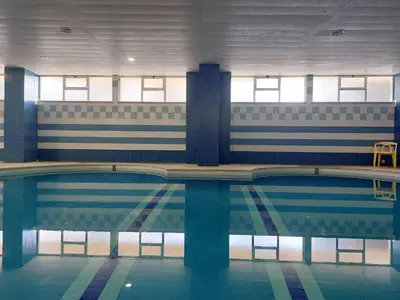 an empty swimming pool in a building at Marina Mar Bela Vista by SAPvillas in Vilamoura