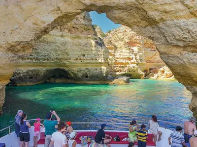 a group of people on a boat in a cave at Luxury 1 Bedroom Apartment, Marina de Albufeira4 in Albufeira