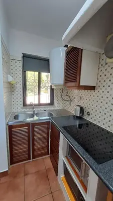 a small kitchen with a sink and a window at SÃO RAFAEL BEACH Apartment 55 in Albufeira