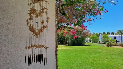 a wall with a bunch of wind chime on it at SÃO RAFAEL BEACH Apartment 55 in Albufeira