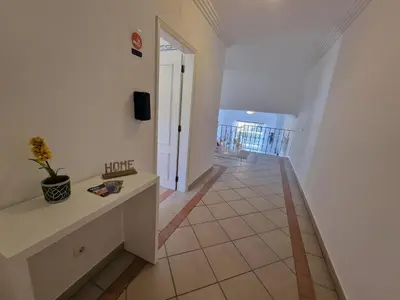 a hallway with a staircase leading to a living room at Charming Villa Albufeira in Albufeira