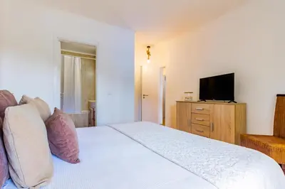 a playground with a slide and a tree at Albufeira Sunny Days | Pool View Family Apartment in Albufeira
