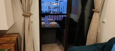 a view of a balcony with a table with dishes at Albufeira View Sea Apartment Luxury in Albufeira
