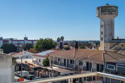 a view of a city with a water tower at Apart OCEAN DRIVE - Oura - Jacuzzi - BY BEDZY in Albufeira
