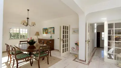 a living room with a couch and a fireplace at Villa Den, private pool villa, Sleeps 6 adults and 2 children, CD 304 - Cleverdetails in Vilamoura