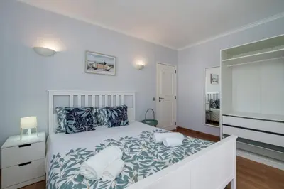 a bedroom with a bed with two towels on it at Villa Lucio by SAPvillas in Vilamoura