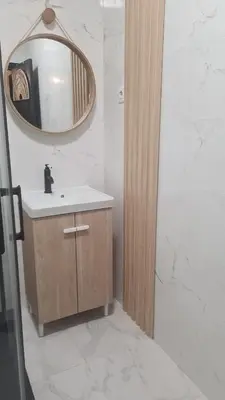 a bathroom with a sink and a mirror at Green Balcony Holiday Work Remote Big Apartment in Albufeira